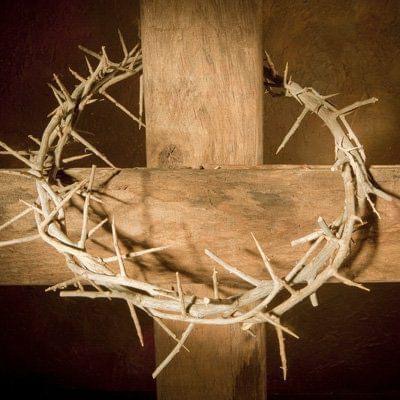 wooden cross with crown of thorns